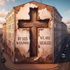 a large wooden cross painted on the side of a building