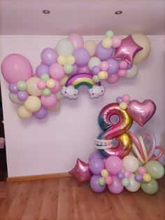 balloons are arranged in the shape of animals and numbers