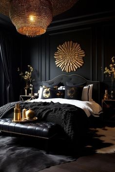 a bedroom with black walls, gold accents and a large chandelier above the bed