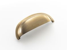 an antique brass door handle on a white background