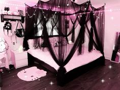 a bedroom decorated in pink and black with hello kitty decorations