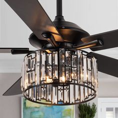 a chandelier hanging from a ceiling fan