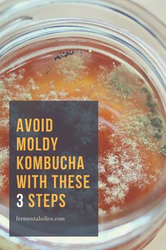 a glass jar filled with liquid on top of a wooden table and the words avoid moldy kombucha with these 3 steps