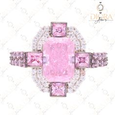 a pink diamond ring with diamonds surrounding it