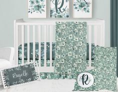 a baby's room with blue and green floral wallpaper, crib bedding, and nursery decor