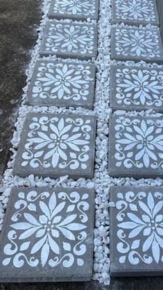 the cement has been decorated with white flowers