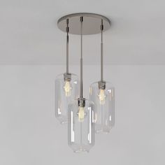 three clear glass lights hanging from a ceiling