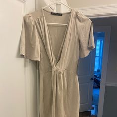 Beautiful Suede-Style Cream Colored Dress With Short Sleeves, V Neck And A Knotted Front. I’m 5’7 And It Hits Me Just Above The Knee. Would Be So Pretty For A Bridal Shower Or Other Spring/Summer Event. Nwt, Never Worn! Fitted Beige Mini Dress With Tie Waist, Beige Tie Waist Fitted Mini Dress, Chic Open Front Dress For Daywear, Spring Open Front Dress With Tie Waist, Chic Open Front Dress With Tie Waist, Spring Dress With Tie Waist And Open Front, Spring Dresses With Tie Waist And Open Front, Beige Short Sleeve Midi Dress For Date Night, Zara Short Dress