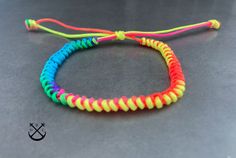 "This is a listing for 1 fluo multicolour snake knot bracelet/ anklet.  - 100% handmade in France - 1mm waxed cotton cord - the bracelet will wrap once around your wrist or ankle and makes for a nice subtle accessory bringing out the outdoor and adventurous person in you. - these bracelets make a great gift for any couple, the bracelets come in a fabric gift bag ready to be offered as a present.  SIZE BRACELET / ANKLET There are 2 sizes available for the bracelet as well as for the anklet , they Snake Knot Bracelet, Snake Knot, Fabric Gift Bag, Bracelet Macrame, Bracelet Mens, Knot Bracelet, Sliding Knot, Ankle Bracelet, Anklet Bracelet