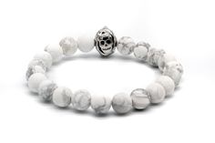 Design: A 11mm antique brass double-sided skull face charm and 8mm Matte White Howlite beads are handcrafted connected with an elastic string. Length: Four sizes available-S, M, L, XL, which can be suitable for most wrists, good matching for men and women. Please measure your wrist to select a proper size before purchase. Packaging: Every bracelet comes with a unique set of CORIRESHA packaging-a samll black suede pouch, a marble pattern box and a marble pattern handbag. Occasion: Wonderful match Adjustable Skull Print Bracelet As Gift, White Skull Print Jewelry For Gift, White Skull Print Jewelry Gift, Casual Skull Jewelry For Gifts, Casual Skull-shaped Jewelry For Gifts, Casual Skull-shaped Jewelry Gift, White Skull Print Jewelry, Casual Skull-shaped Gift Jewelry, Silver Skull Beaded Bracelets As Gift