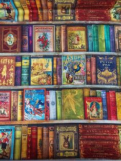 many books are stacked on top of each other in a book shelf with colorful covers