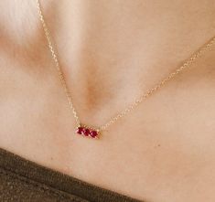 A beautiful Ruby bar necklace with 3 Rubies 3 mm each in 14K solid gold, July Birthstone. This fine jewelry is nice for a gift for her! We offer more options in the drop down menu.PRODUCT DETAILS● Material: 14K solid gold - white gold - rose gold● Gemstones: Rubies natural● Gemstones Weight: 0.43ctHOW TO ORDER - CUSTOM ORDERS● Choose from the drop down menu the available options (Length, Material) and leave us a note for any special requirements.● For special orders forward us pictures of the de Gold Three Stone Necklace As Gift, Gold Three Stone Necklace Gift, Gold Three Stone Necklace For Gift, Three Stone Gold Necklace As Gift, Anniversary Three Stone Yellow Gold Necklace, Fine Jewelry Three Stone Necklace For Gift, Anniversary Yellow Gold Three Stone Necklace, Dainty Three-stone Jewelry Gift, 14k Gold Bar Necklace For Anniversary