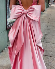 Prom Dress With Big Bow, Pink Dress With Bow On Back, Prom Dress With Bow On Back, Floor-length Prom Dress With Bow, Pink Bow Tie Back Dress For Prom, Pink Bridesmaid Dress With Bow Tie Back, Pink Satin Dress With Bow Tie Back, Pink Satin Maxi Dress For Banquet, Sleeveless Pink Maxi Dress For Wedding