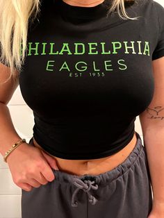 Black Philadelphia Eagles crop top  -One medium and one small currently available  -Black crop top from H&M,  Divided brand -95% cotton & 5% spandex  -Kelly green print  -Wash inside out on cold setting and hang to dry for best results or tumble dry low Green Stretch Cotton Cropped T-shirt, Fitted Green Crop Top With Graphic Print, Cotton Graphic Print Crop Top For Sports, Green Stretch Cotton Crop Top, Green Crew Neck Crop Top For Streetwear, Black Stretch Crop Top With Graphic Print, Sporty Stretch Crop Top With Graphic Print, Green Casual Crop Top For Sports, Black Stretch Cropped T-shirt With Letter Print