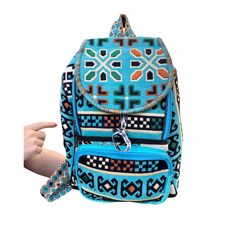 This handwoven authentic Ice Turquoise backpack is %100 hand made. The bag has a unique motif and a beautiful color scheme. Motifs of our bags have different meanings that came from ancient times. Ancient people in Anatolia use different handwoven rugs/ kilims at home as a charm to expect wellness. Nowadays, We use motifs of kilim for fashion and help to give charms people to bring wellness. Extremely comfortable & strong backpack can be used for any occasion. The backpacks are featured with one Rectangular Blue Travel Backpack, Blue Rectangular Travel Backpack, Blue Rectangular Backpack For Travel, Blue Travel Backpack Shoulder Bag, Bohemian Turquoise Travel Bag, Light Blue Standard Backpack, Light Blue Daily Use Standard Backpack, Light Blue Standard Backpack For Daily Use, Blue Rectangular Backpack With Adjustable Strap