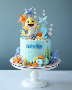 a birthday cake decorated with an ocean theme