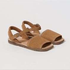 Zara Kids Brown Leather Sandals Summer Spring Sandals In 100% Cowhide Leather. Contrast Color Topstitching. Side Buckle Closure And Back Strap For A Better Fit. Insole In 100% Cowhide Leather. Rubber Soles. Leather: The Material Used To Make Each Product Has Its Own Unique Features. Any Possible Markings Or Color Variations Are Signs Of The Authentic Nature Of The Leather Used. Adjustable Closed Toe Sandals With Stitched Sole, Leather Open Toe Sandals With Soft Sole, Zara Adjustable Round Toe Sandals, Adjustable Leather Sandals By Zara, Zara Leather Slingback Sandals For Summer, Zara Leather Open Toe Slingback Sandals, Zara Brown Leather Sandals, Spring Sandals, Brown Leather Sandals