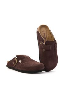 Step into style and comfort with the MAIBULUN Cruise Anywhere Suede Clog in dirt resistant chocolate. These versatile clogs are perfect for any occasion, from a relaxing weekend cruise to a busy day of errands. The soft suede material and slip-on design make them a must-have for any shoe collection. Go anywhere in style with these clogs. 0.78" Heel Slip-on / buckle closure Hard Cushioned footbed Suede 100% leather upper Leather lining EVA sole Brown Round Toe Clogs For Outdoor, Brown Outdoor Mules With Cushioned Footbed, Brown Round Toe Mules For Outdoor, Comfortable Brown Mules For Outdoor, Comfortable Brown Outdoor Mules, Brown Outdoor Clogs With Removable Insole, Brown Outdoor Clogs With Cork-bed Midsoles, Comfortable Brown Clogs For Outdoor, Suede Clogs