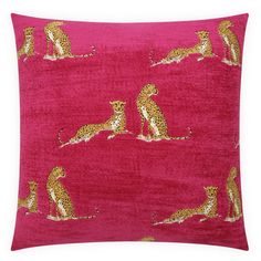 a pink pillow with gold cheetah and leopards on the front, along with an orange background