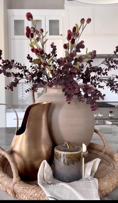 a vase filled with flowers sitting on top of a table