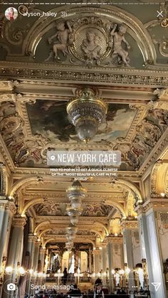 an ornately decorated room with chandeliers and paintings on the ceiling, in new york city