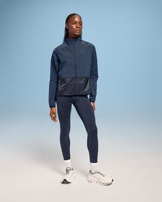 A running jacket for ultralight protection from the elements. Made with breathable, windproof fabrics, it’s ideal for changing weather | On Women's Weather Jacket in Denim/Navy, Size: XL. Running, ultralight protection, windproof Road Running. Performance Running | Recycled Polyamide/Recycled Polyester Technical Moisture-wicking Outerwear For Running, Breathable Recycled Polyester Functional Outerwear, Breathable Functional Outerwear In Recycled Polyester, Functional Track Jacket For Running, Athleisure Waterproof Running Outerwear, Waterproof Athleisure Outerwear For Running, Athleisure Windproof Windbreaker For Running, Windproof Athleisure Windbreaker For Running, Windproof Athleisure Outerwear For Running