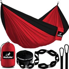 a red hammock with black straps and accessories