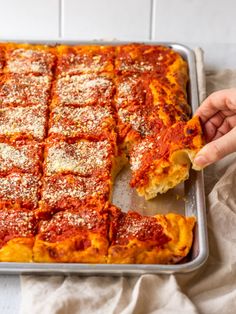 a pan filled with lasagna casserole covered in cheese