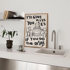 a kitchen counter with a sink and a poster on the wall above it that says i'll give you kisses if you do the dish