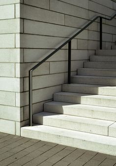 there is a set of stairs leading up to the top floor and bottom part of the building