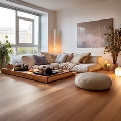 the living room is clean and ready for us to use it's natural wood flooring