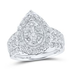 a white gold ring with diamonds on the sides and an intricate design in the middle