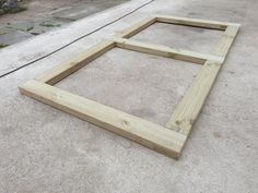 a wooden frame laying on the ground