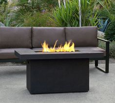 a fire pit sitting on top of a black table