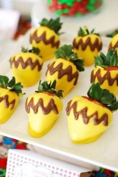 chocolate covered strawberries are arranged on a plate