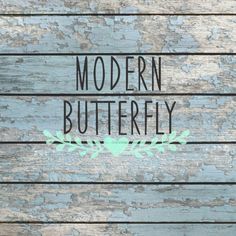 the words modern butterfly are painted on wood