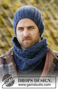 a man wearing a blue hat and scarf