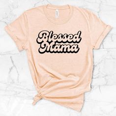 Super soft Blessed Mama shirt. Perfect for a birthday or Mother's Day gift! PLEASE include the date that you need your order by, thank you!! *What brand of shirts do you use? For this design, I use Bella brand shirts. Gildan can be requested. *What is your turnaround time? I work diligently to get your order made and shipped within a 2 week time frame.  Excludes weekends and holidays. If you need an order quicker or by a certain date, please message me to confirm that I can do it. If you have a Blessed Mama Shirt, Momma Shirts, Gigi Shirts, Personalized Birthday Shirts, Nana Shirts, Blessed Mama, Nana Gifts, Brand Shirts, Thanksgiving Shirt