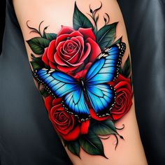 a blue butterfly and red roses tattoo on the arm