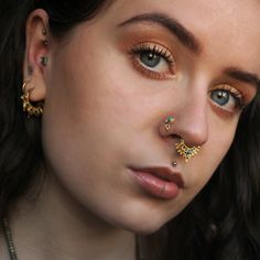 Beautiful 2-micron gold plating over sterling silver nose stud set with turquoise/green onyx and a little ball charm. 20 Gauge - 0.8mm Stone size: 3mm / 0.11'' total diameter:5mm / 0.19'' This listing is for a SINGLE nose stud. For more gold nose studs, click the link below: https://www.etsy.com/il-en/shop/RONIBIZA?ref=listing-shop2-all-items-count&search_query=gold+nose+stud For more nose studs, click the link below: https://www.etsy.com/il-en/shop/RONIBIZA?section_id=14762261 Back to my sh Indian Nose Piercing, Nostril Stud, Nose Stud Piercing, Stud Nose Piercing, Piercing Nostril, Silver Nose Stud, Tiny Nose Studs, Gold Nose Pin, Tiny Nose