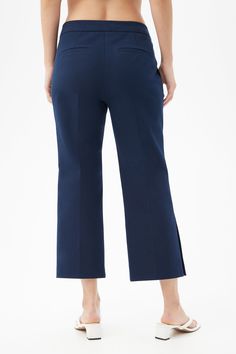 The cropped pant you need in your wardrobe, this slim fit pant is flattering for every day of the week. Pair these cropped kick-flare pants with a fun pattern for vacation-ready style or with a polished top for a more classic look. Hook and zip closure Side slits Side slash pockets Back welt pockets Cropped length Kick flare Inseam: 26" Runs true to size Model is 5'10", wearing size 2 See Women's Size Guide FABRIC: Cotton Bi-Stretch 96% Cotton, 4% Elastane Dry clean only Imported Kick Flares, Day Of The Week, Slim Fit Pants, Trina Turk, Shop Swimwear, Cool Patterns, Flare Pants, Welt Pockets, Workout Pants