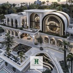 an aerial view of a building with palm trees in the background