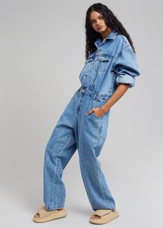 Color: Dark Indigo Cotton denim fabric Traditional jumpsuit style Straight leg Pointed collar Slant hip pockets Front button closure Zip fly Unlined 100% Cotton Dry Clean Imported Product Measurements: S- 21" Shoulder, 44" Bust, 34" Waist, 29" Inseam M- 22" Shoulder, 46" Bust, 36" Waist, 29.5" Inseam L- 23" Shoulder, 48" Bust, 38" Waist, 29.75" Inseam XL- 24" Shoulder, 50" Bust, 40" Waist, 30" Inseam Model is 178cm/ 5'10" wearing size S Cheap Dark Wash Cotton Denim Jumpsuit, Affordable Dark Wash Denim Overall Jumpsuit, Cheap Washed Blue Women's Denim Jumpsuit, Affordable Dark Wash Denim Jumpsuit For Spring, Cheap Washed Blue Denim Jumpsuit For Women, Cheap Relaxed Fit Denim Jumpsuit With Pockets, Cheap Straight Leg Denim Jumpsuit, Cheap Casual Cotton Denim Jumpsuit, Affordable Cotton Denim Jumpsuit With Buttons