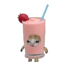 a small dog is sticking its head out of a milkshake with strawberries on top