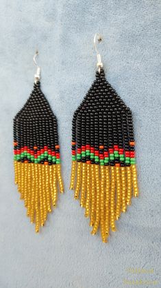 These handmade earrings are made of high-quality Czech beads and strong synthetic thread.In these unique earrings I use my author's scheme . They are elegant, fashionable, and highly versatile, suitable for everyday wear. Color: black,red, green, orange . 100% hand made with love! Copy without my permission is prohibited Measurements: Length-about 10.5cm,Width -3 cm Materials: Silver tone metalic plated ear hooks Czech glass beads Tytan Thread Handwoven Drop Beaded Earrings Gift, Handwoven Drop Earrings For Gifts, Handmade Adjustable Earrings For Celebration, Unique Festive Beaded Drop Earrings, Festive Unique Beaded Drop Earrings, Handwoven Round Beads Earrings As Gift, Black Beaded Dangle Earrings, Traditional Beaded Chandelier Earrings As Gift, Unique Black Beaded Earrings As Gift