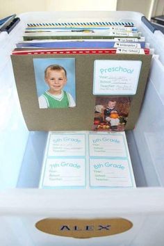 a white plastic container filled with lots of cards and folders on top of it