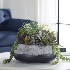 a table with a planter on top of it