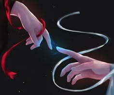 two hands touching each other over a black background with red and white streamers in the air