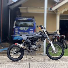 a dirt bike parked in front of a house