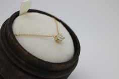 "This classic necklace features a round floating diamond basket set. Beautiful solitaire diamond necklace, perfect for a sparkly everyday look. *4 mm= .25 carats approximately. *4.4 mm= .33 carats approximately. *4.8 mm= .40 carats approximately. * Handmade in the USA. * Gold KT: 14K/18K gold. * Diamonds: Round Diamond * Color and Clarity: H (or better) / SI2 (or better). * Chain type: 1 mm cable chain, Lobster clasp. * Chain length: 15\"-16\", 17\"-18\". * Setting Type: Basket Setting. * Made t Timeless Solitaire Diamond Necklace Gift, Timeless Gift Solitaire Diamond Necklace, Round Solitaire Necklace With Tension Setting For Anniversary, Timeless Round Solitaire Necklace With Tension Setting, Round Solitaire Necklace With Tension Setting, Fine Jewelry Diamond Necklace With Tension Setting, Diamond Solitaire Necklace With Tension Setting, Diamond Necklace With Tension Setting And Round Cut, Classic Necklace With Round Pendant In Tension Setting